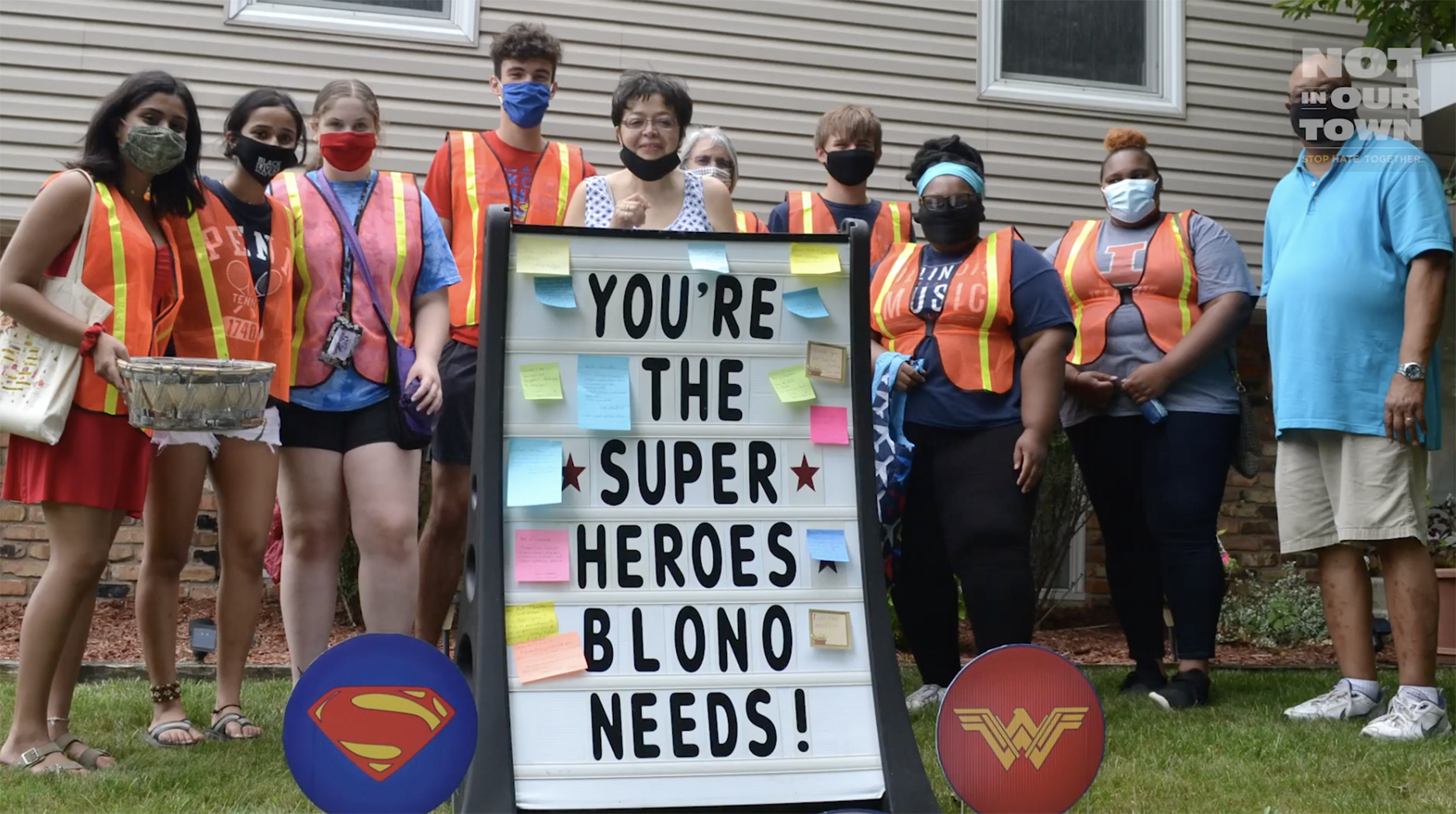 The Taylor Family surrounded by Not In Our Town Bloomington Normal group. 