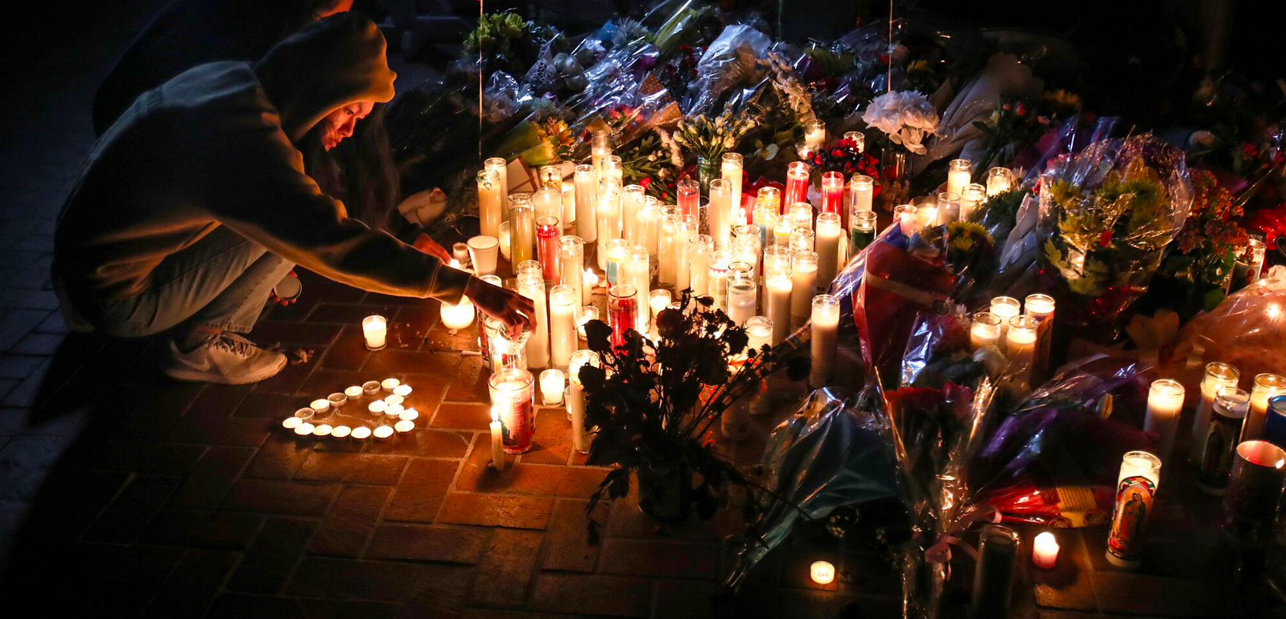 On Monday evening mourners took part in a vigil for victims of the Monterey Park mass shooting at Star Ballroom Dance Studio on the eve of Lunar New Year.(Allen J. Schaben / Los Angeles Times)